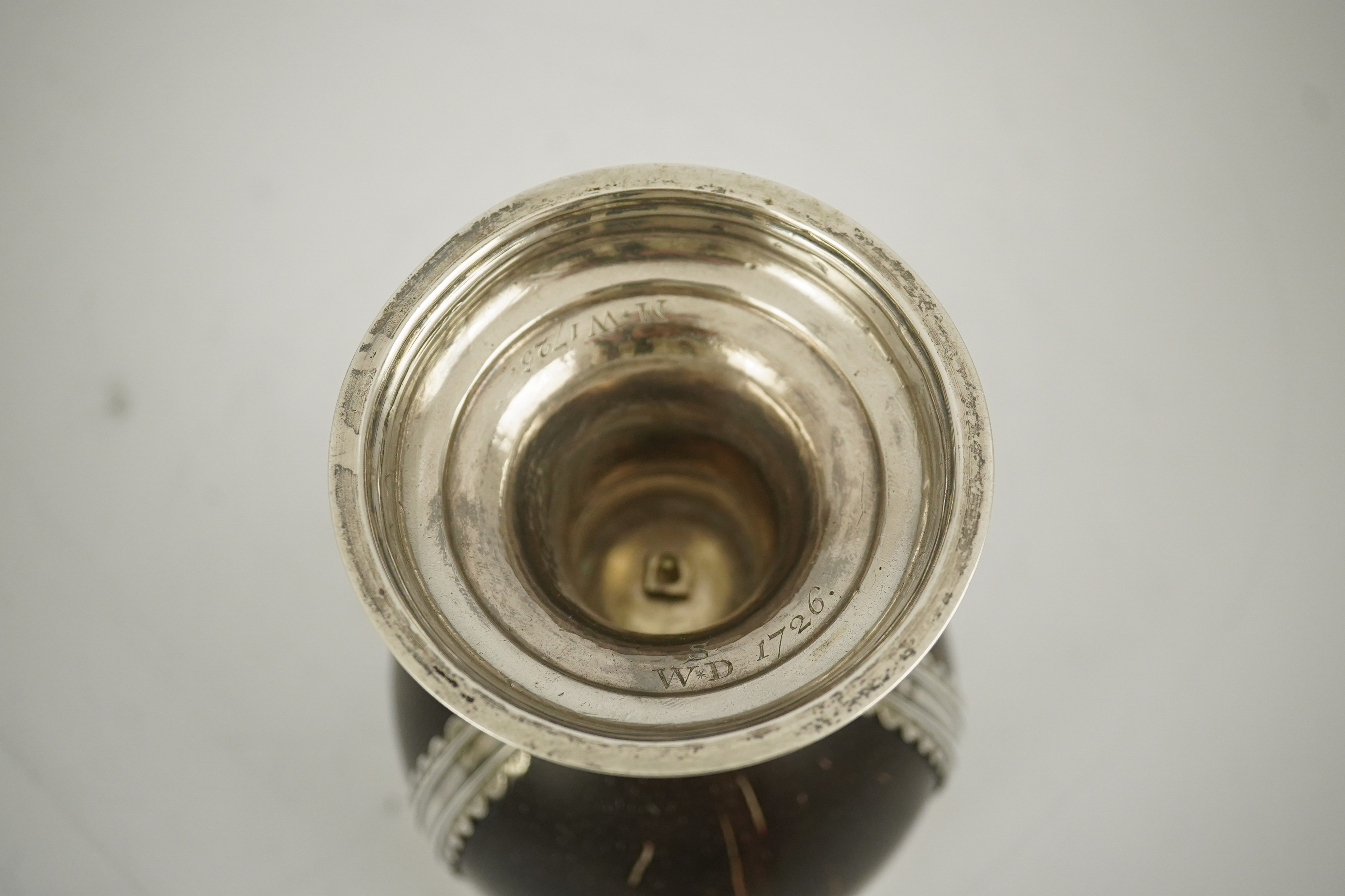 A late George I? silver mounted coconut cup, makers mark only, possible Samuel Eaton, London